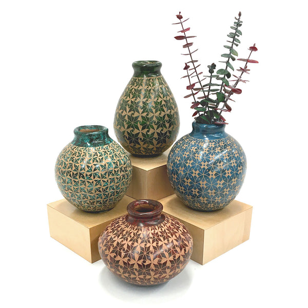Ceramic vessel with hand-cut single-color design