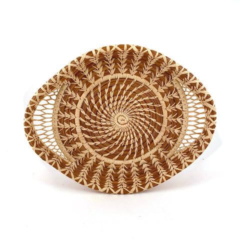 Large lacy woven pine needle tray